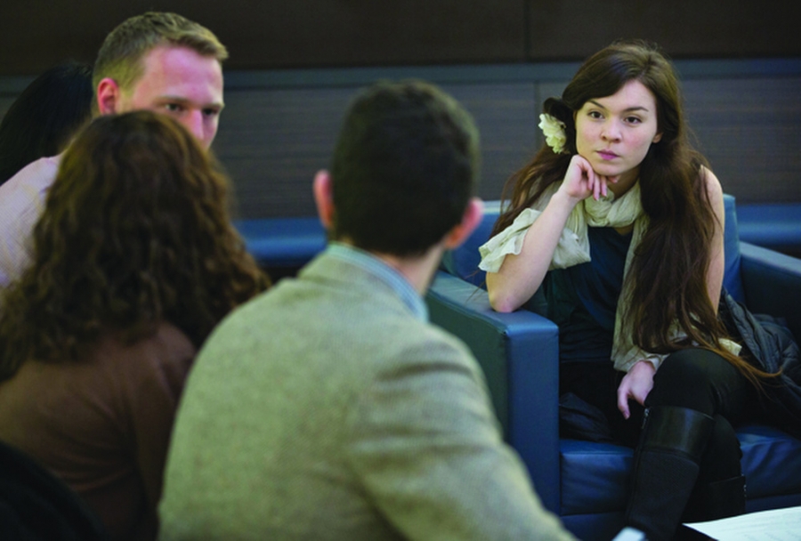 a group of externs talking in a small group